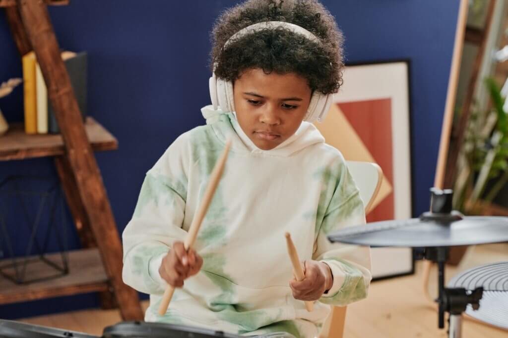 Child playing drums