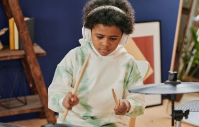 Child playing drums