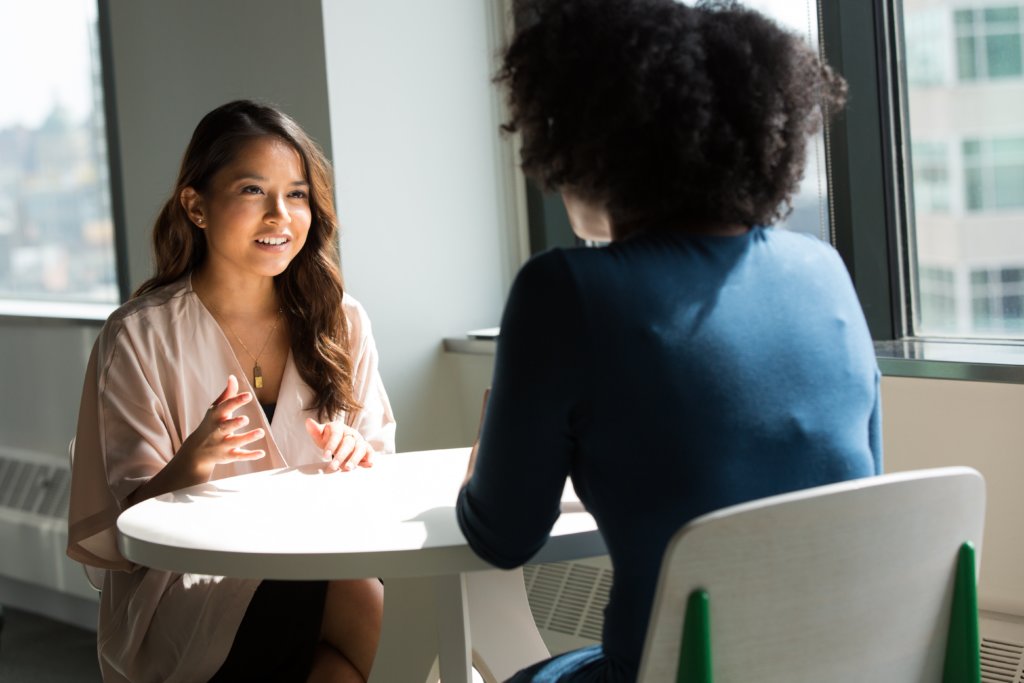 Women or coworkers having meeting, talking