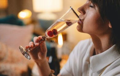 Woman drinking glass of champagne