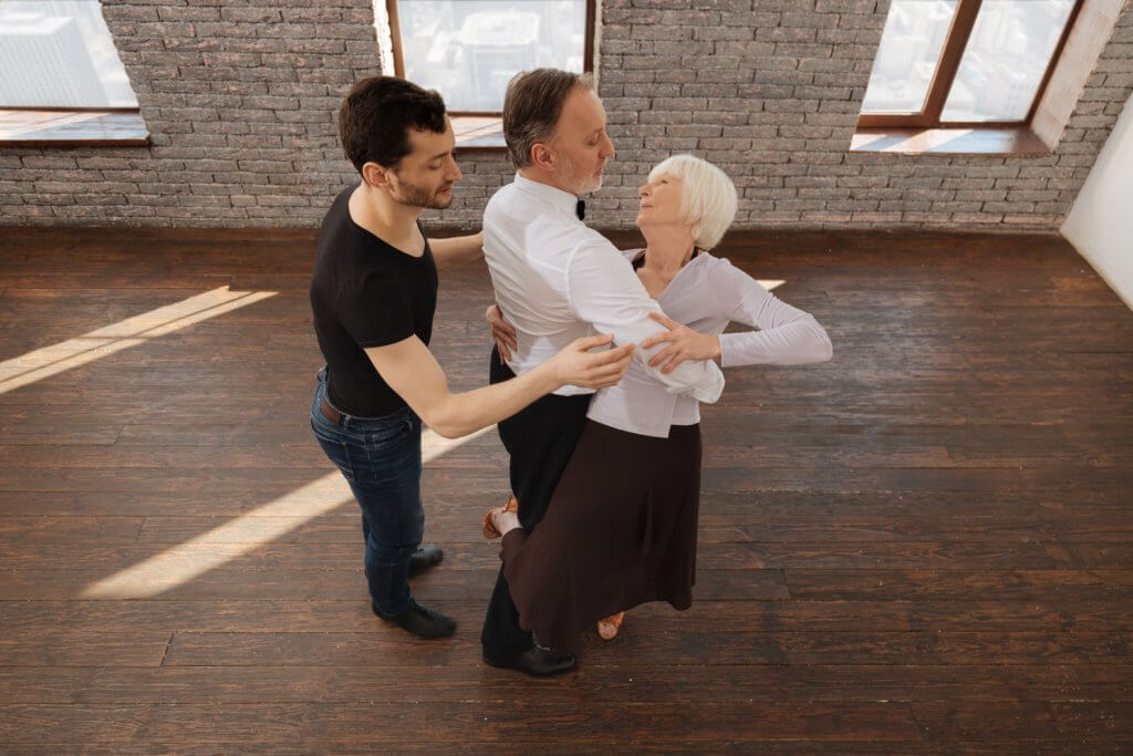 Senior couple taking ballroom dancing lessons