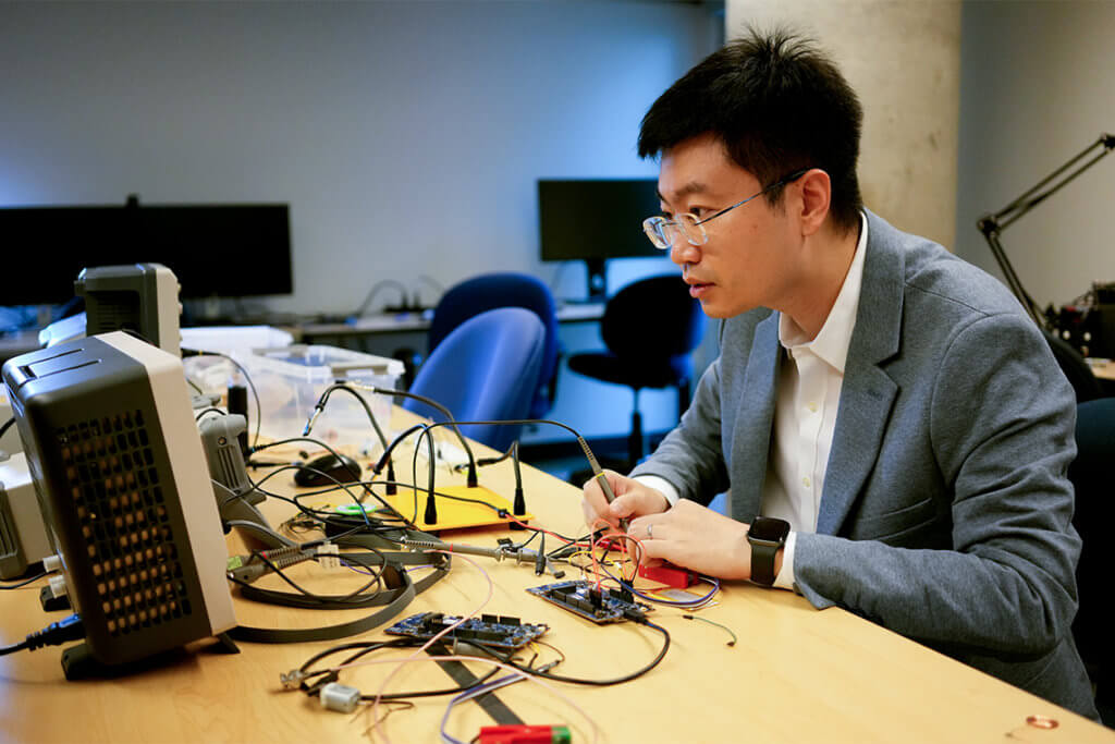 Xilin Liu tests signal integrity of a prototype neural implant